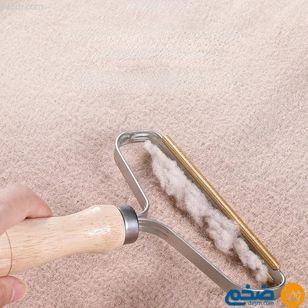 A tool for removing lint from clothes and carpets متجر ضخم