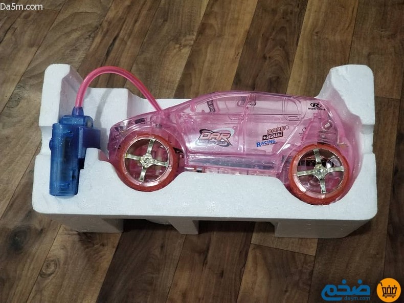 Musical racing car toy with glowing lights