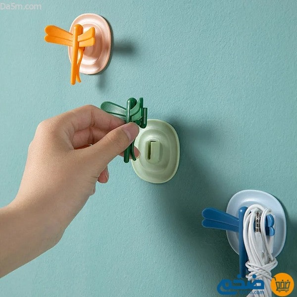 Magnetic adhesive wall clip and hook